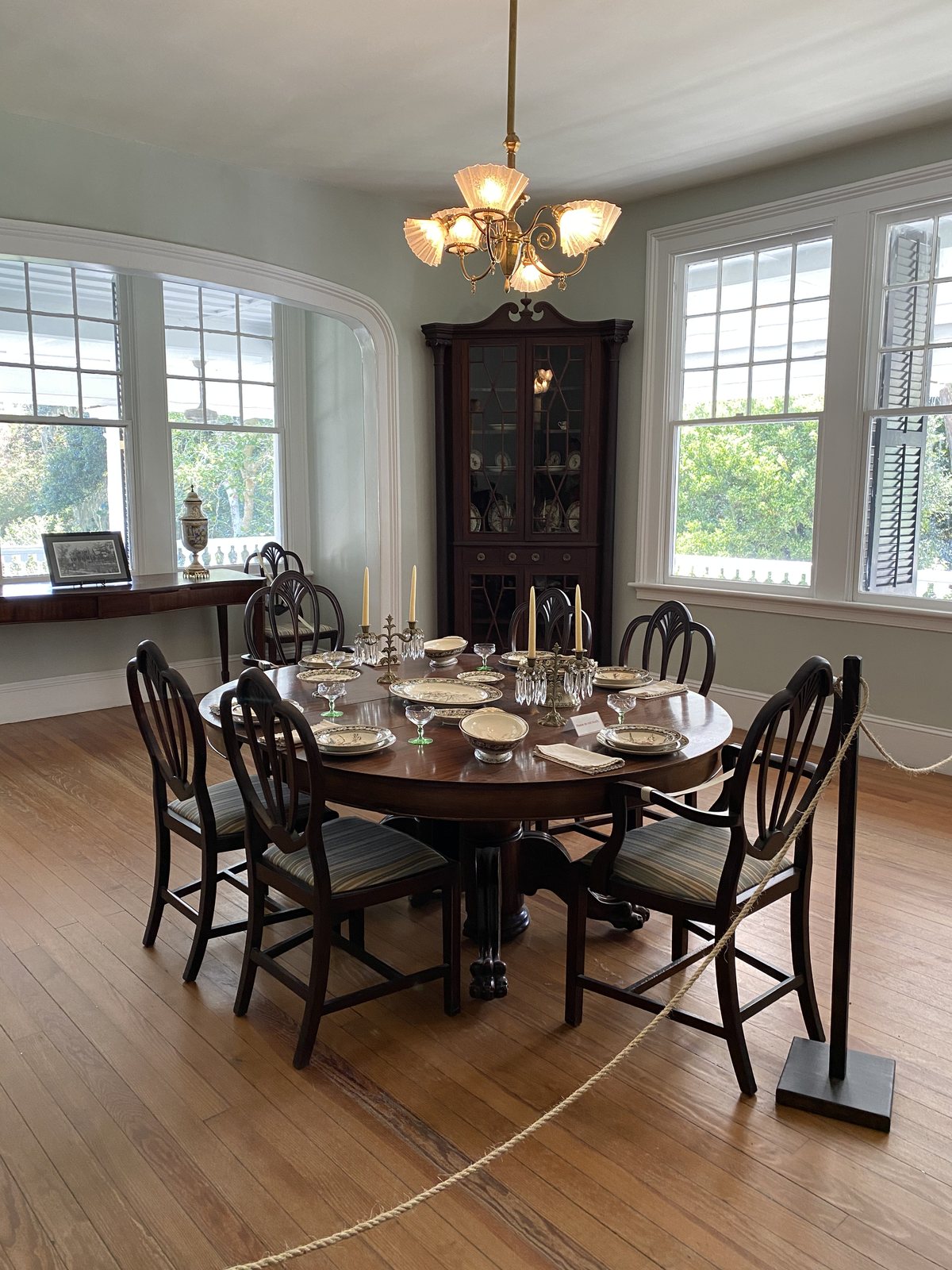 The dining room. Table set, rope up, nobody eating.