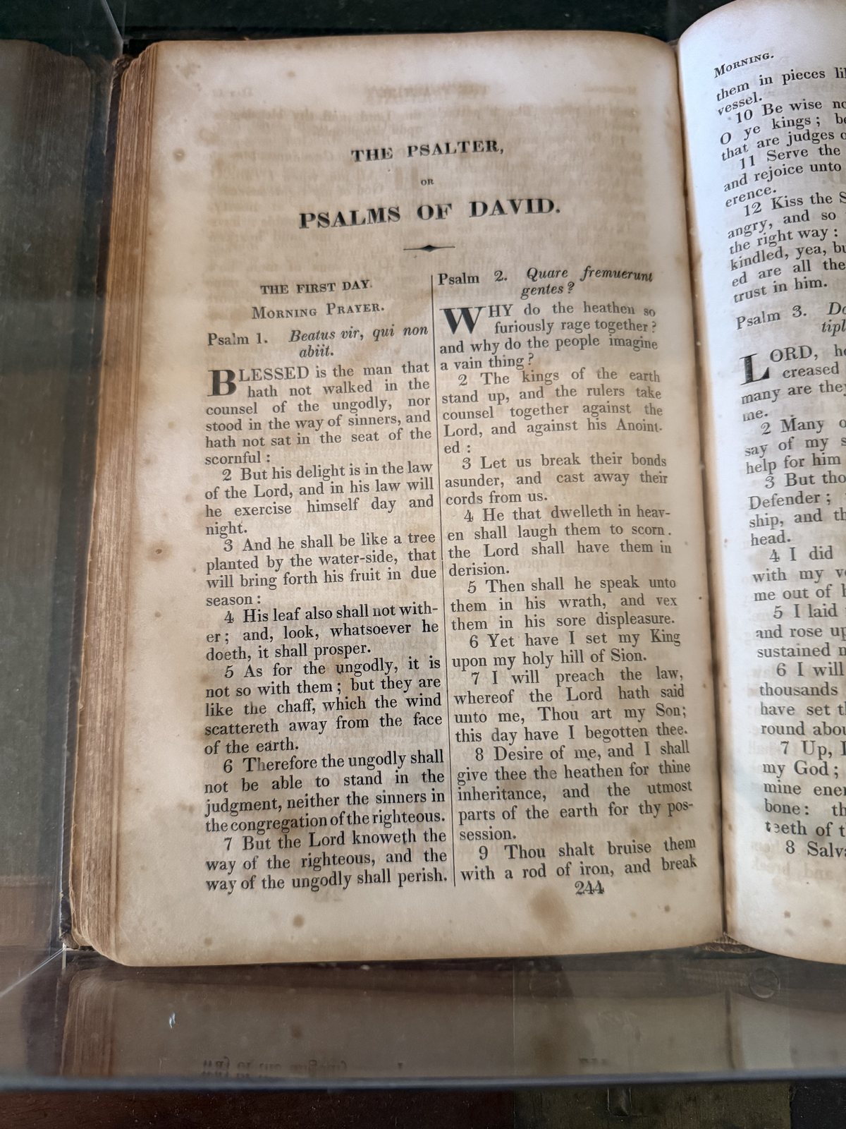 The Psalms of David, family edition, open under glass.