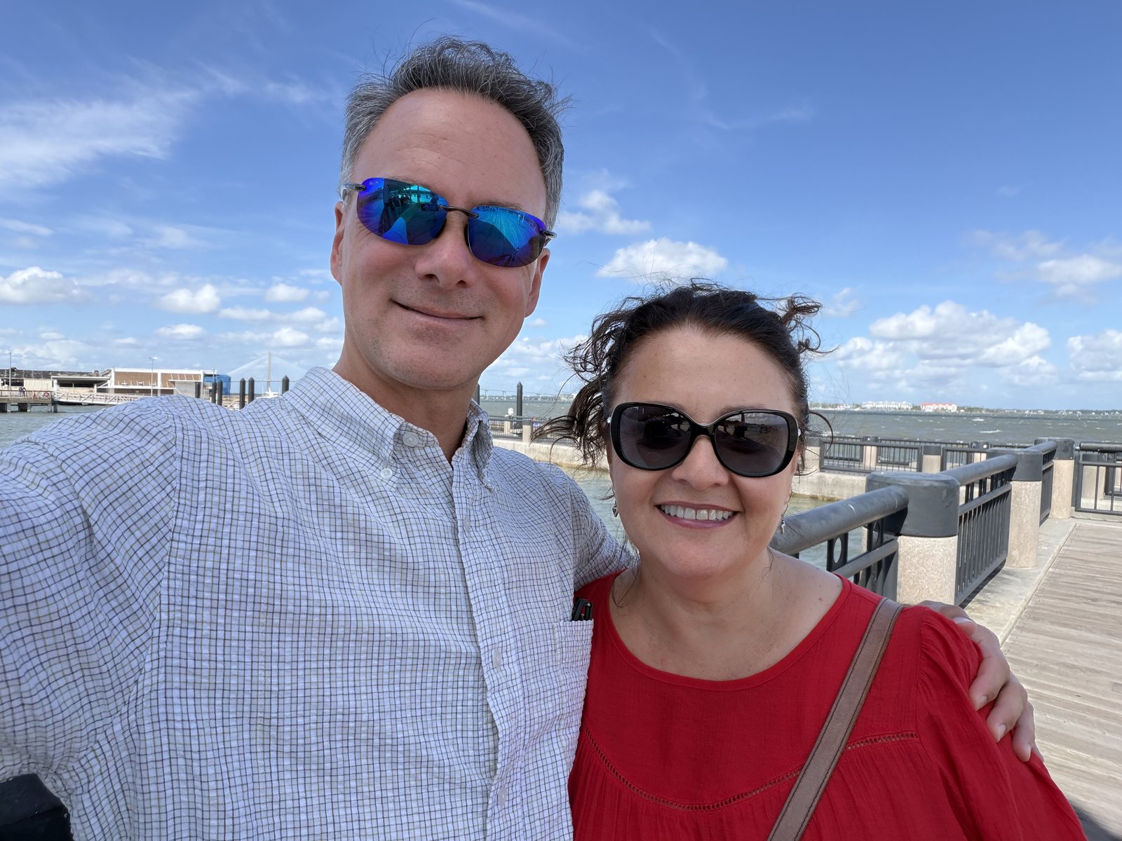 Mommy and Dad on the pier. Wind: strong. Hair: doing its own thing.