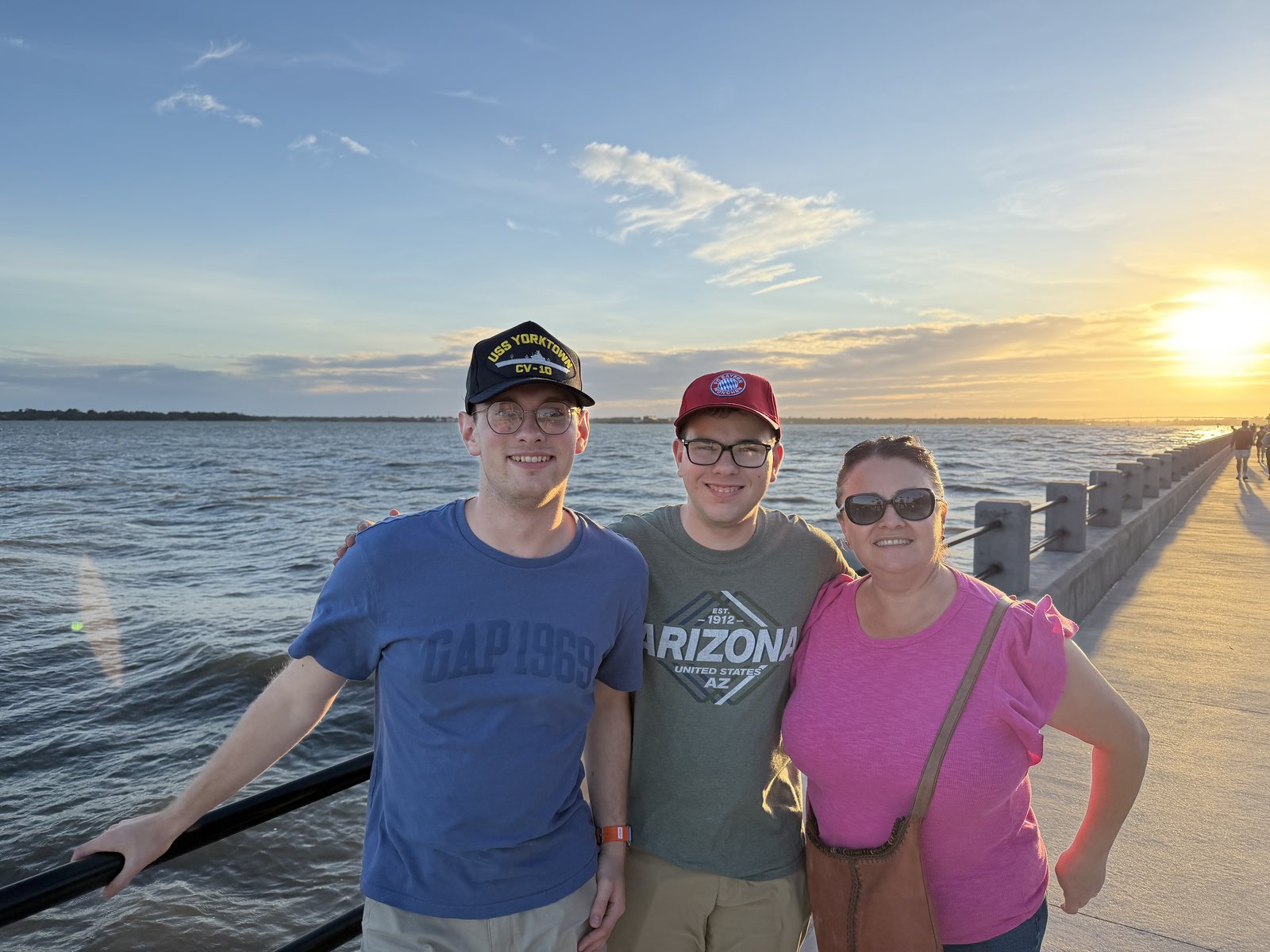 The Battery at sunset. Mommy and the boys, the harbor behind.