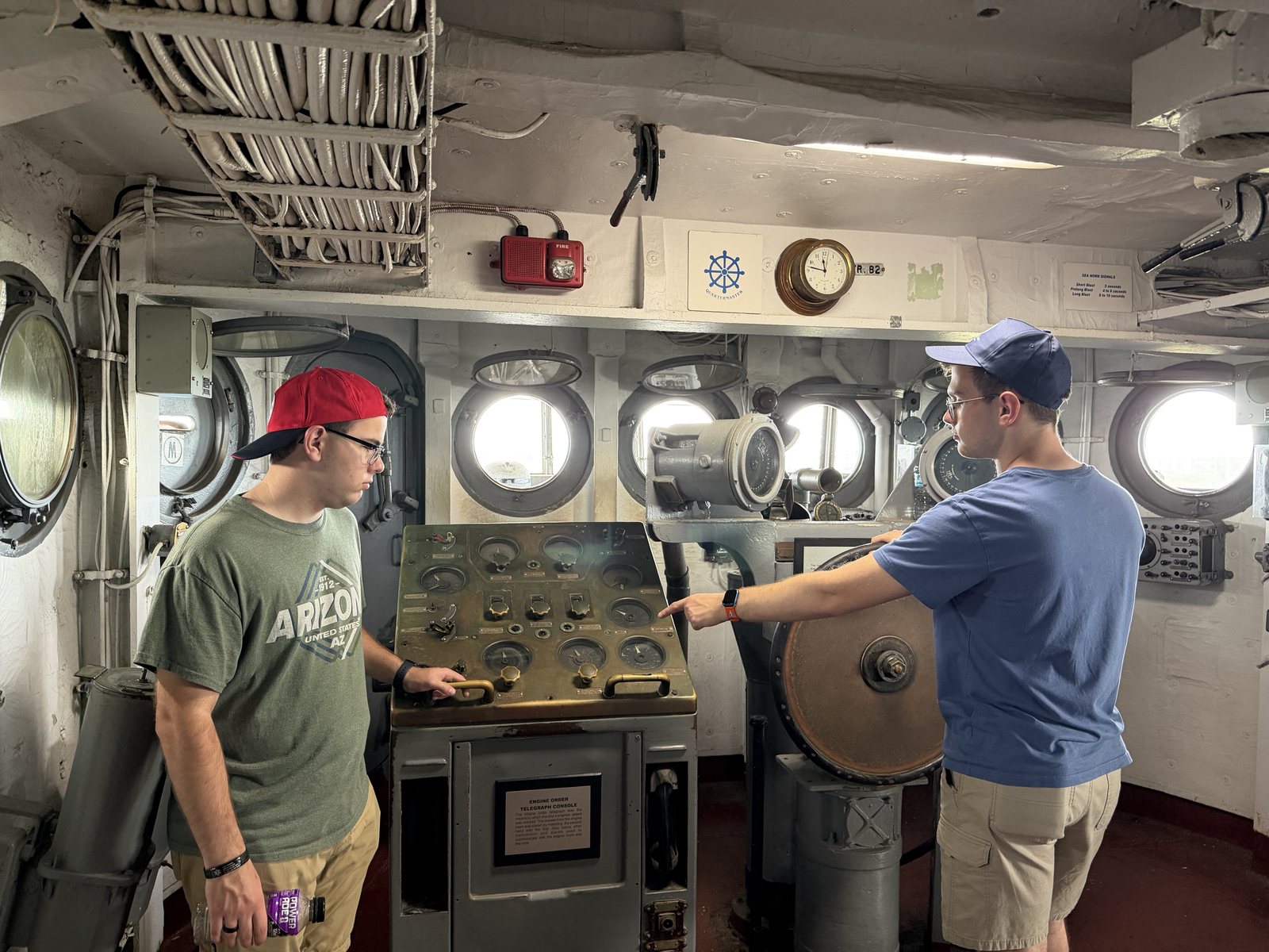The navigation room. Travis, at the helm, points Liem to his station: "You. Over there."