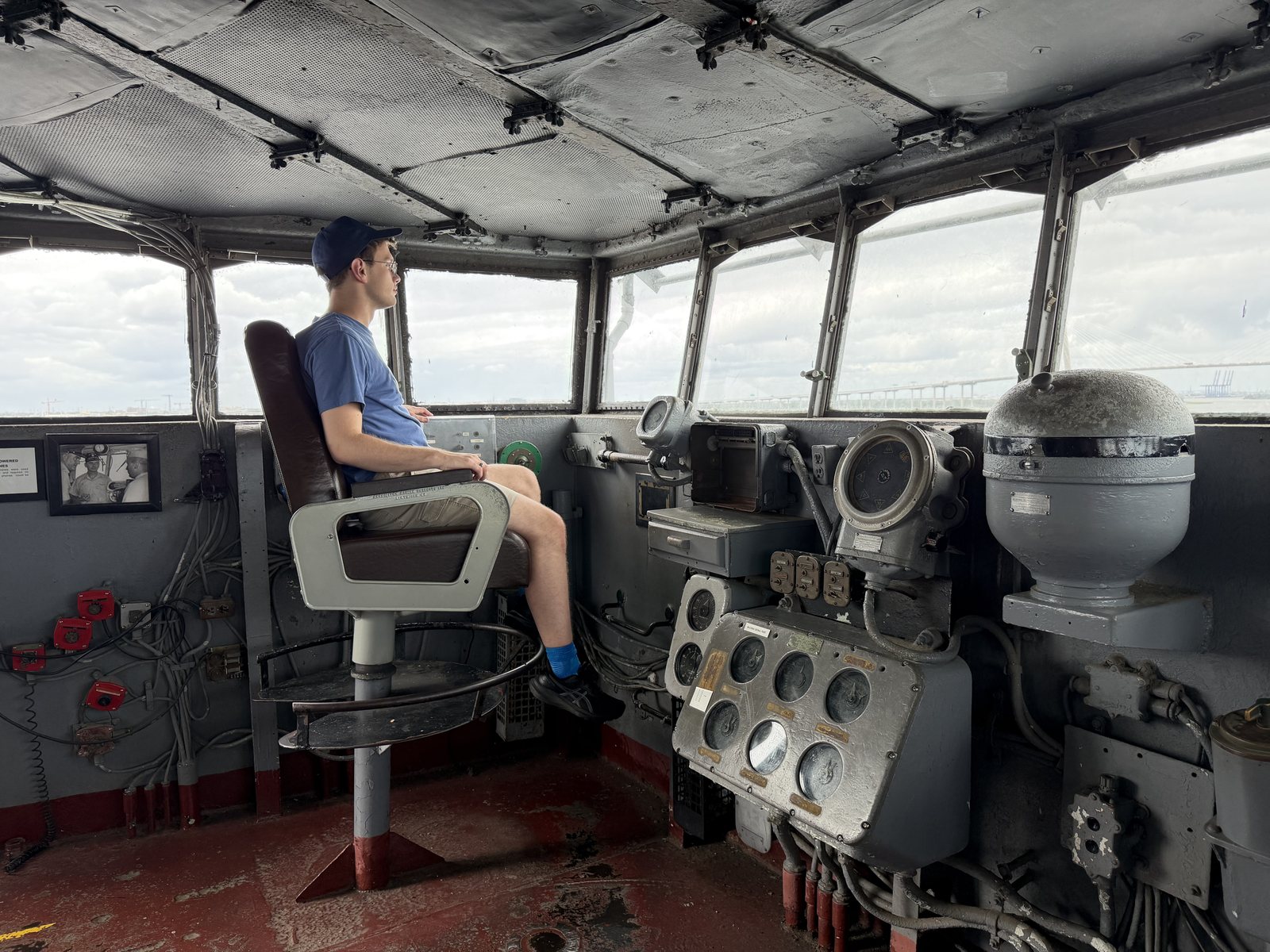 The captain's chair on the bridge. Command was briefly transferred to Travis, blue hat, blue shirt, full authority.
