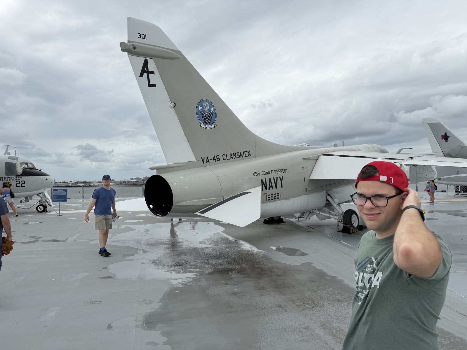 Liem, red hat, A-7 Corsair. Travis, blue hat, checking the engine.