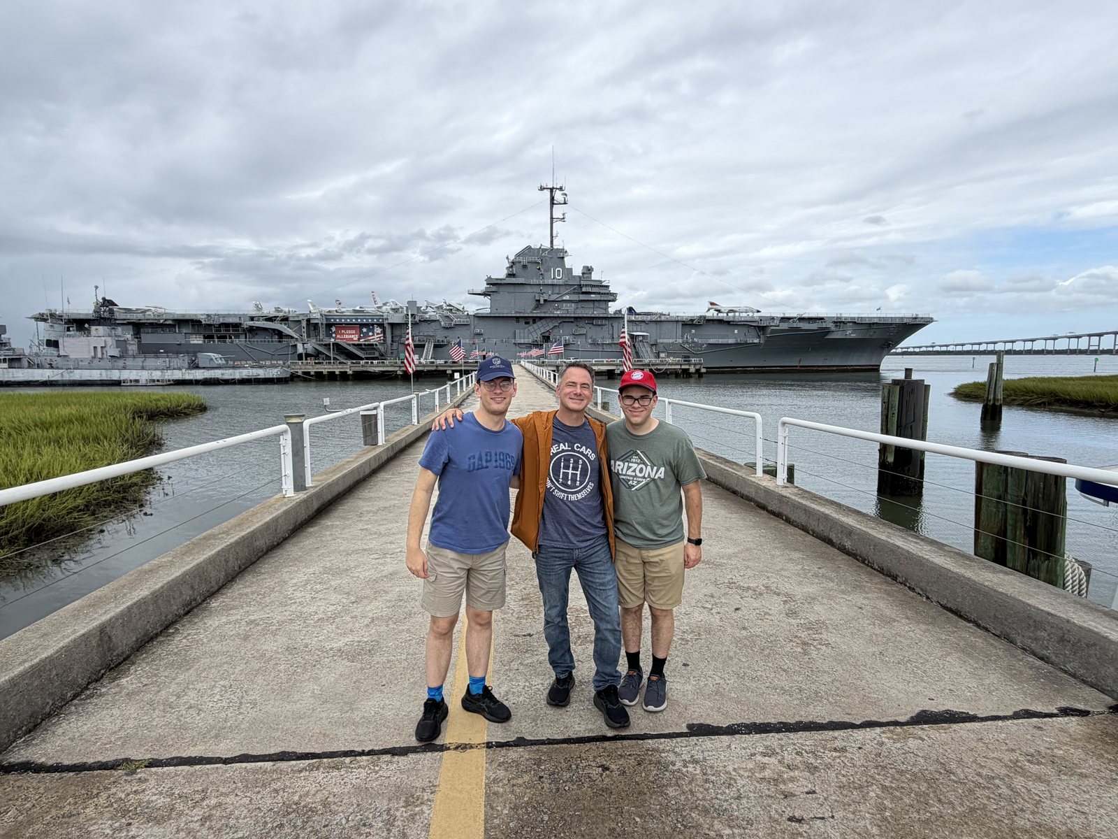 The pier, the boys, and Dad. The Yorktown photobombing.