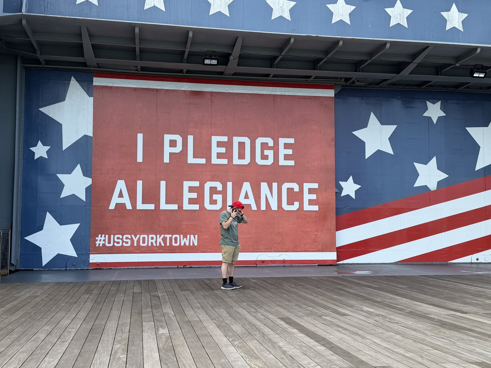 #USSYORKTOWN. One boy, one very large flag.