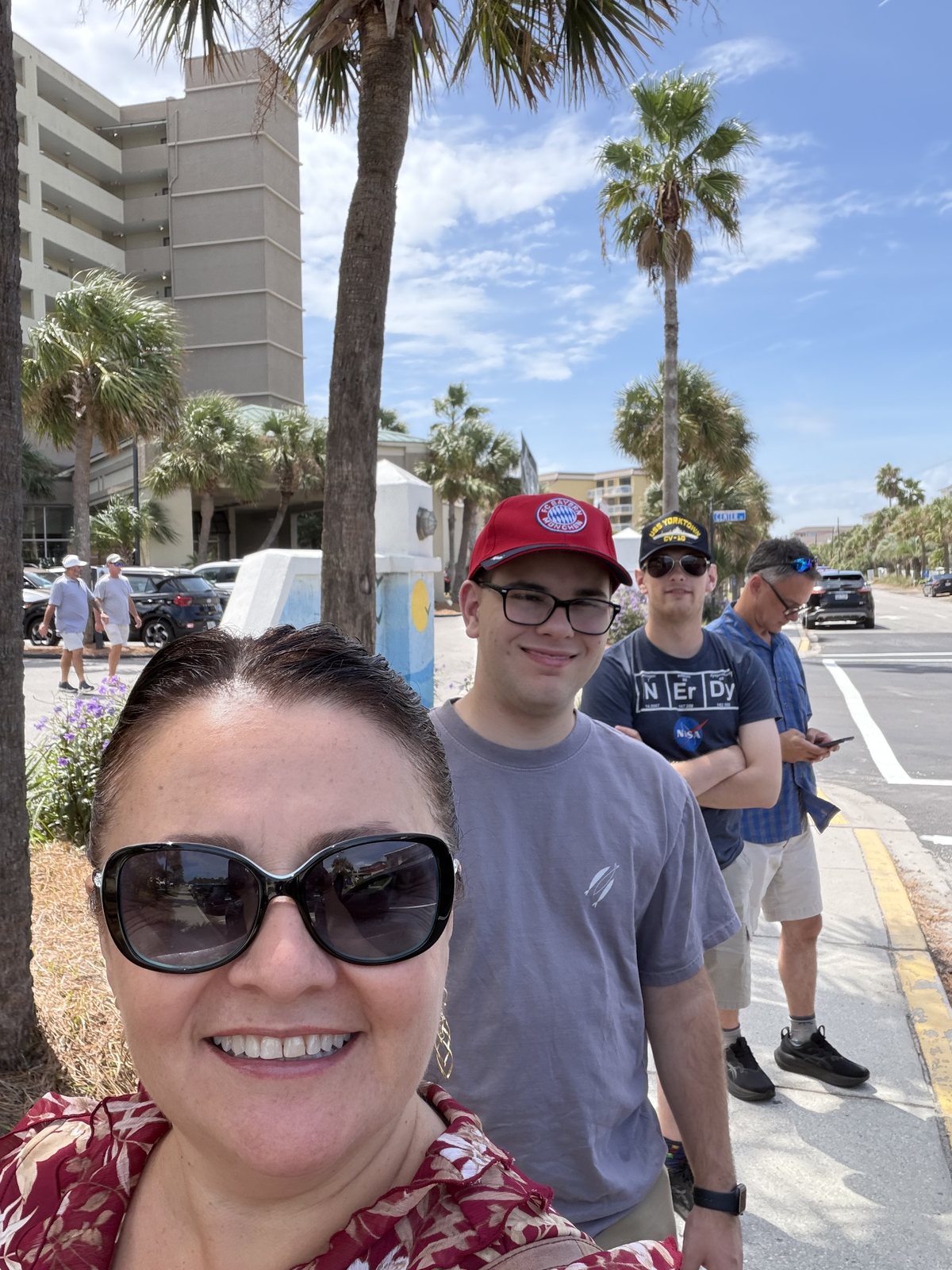Folly Beach, 1:34pm. Palms, hotel, sunglasses.